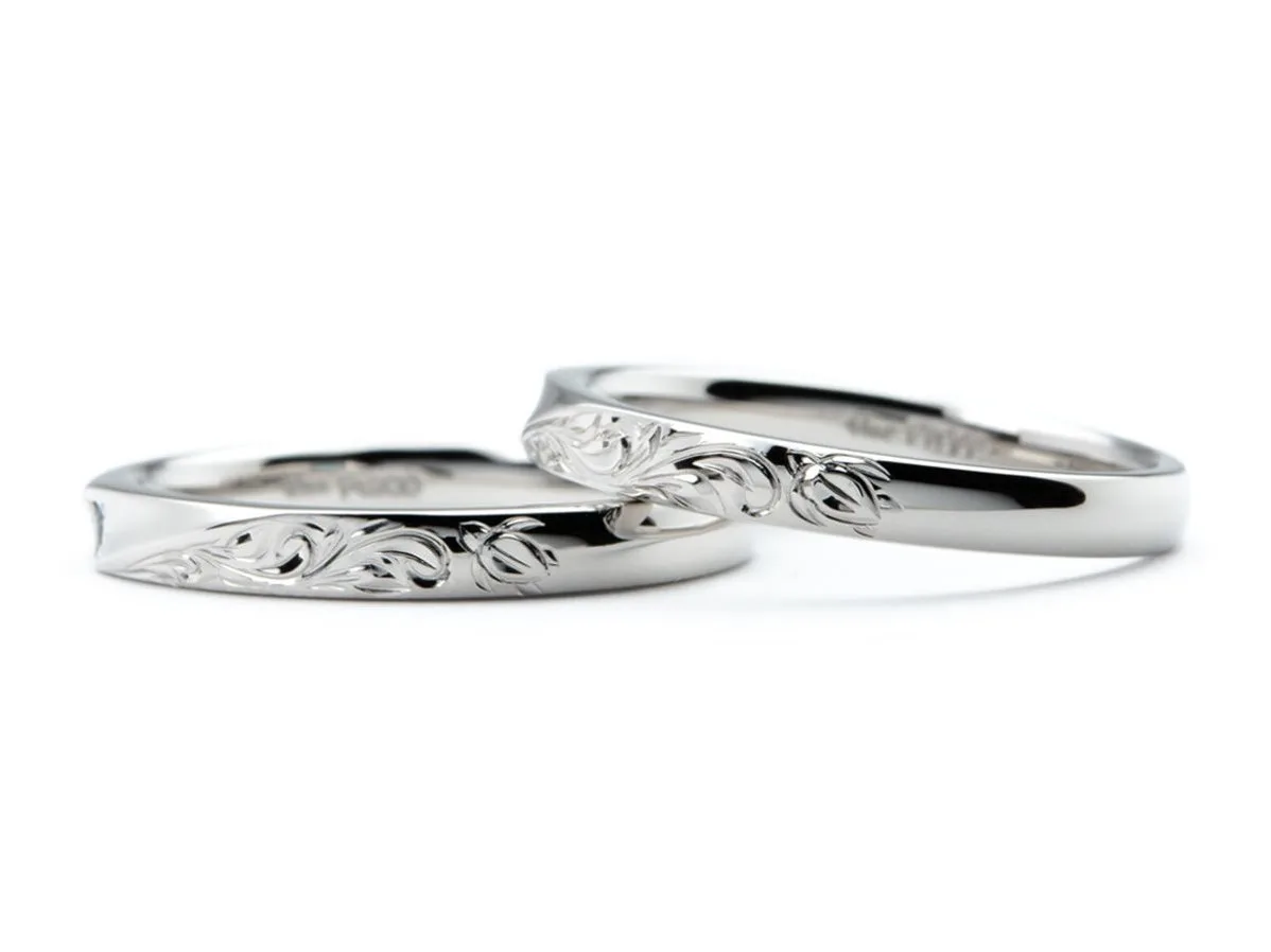 お互いの誕生石をお留めしたひねり×ハワイアン彫りの手作り結婚指輪 2