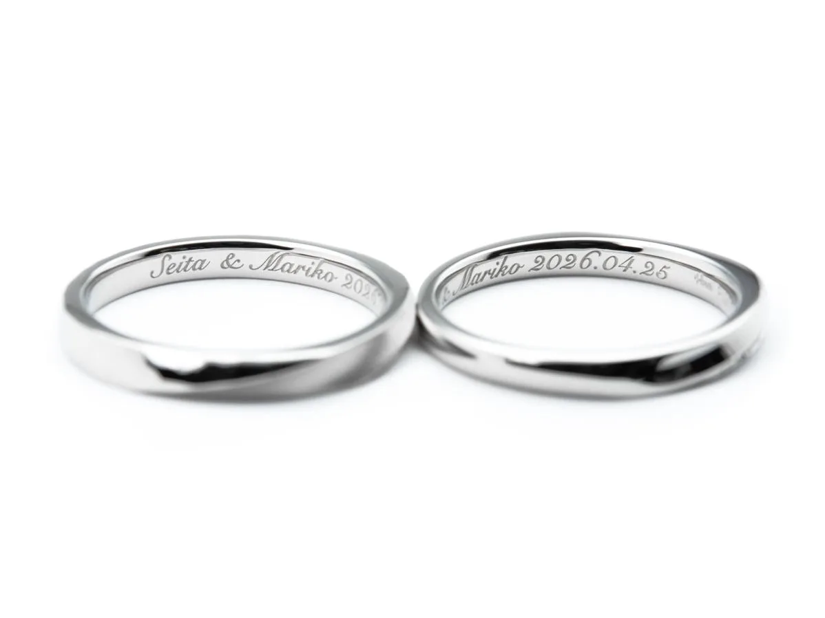 ダイヤモンドをずらっと留めた華やかなひねりの結婚指輪 2
